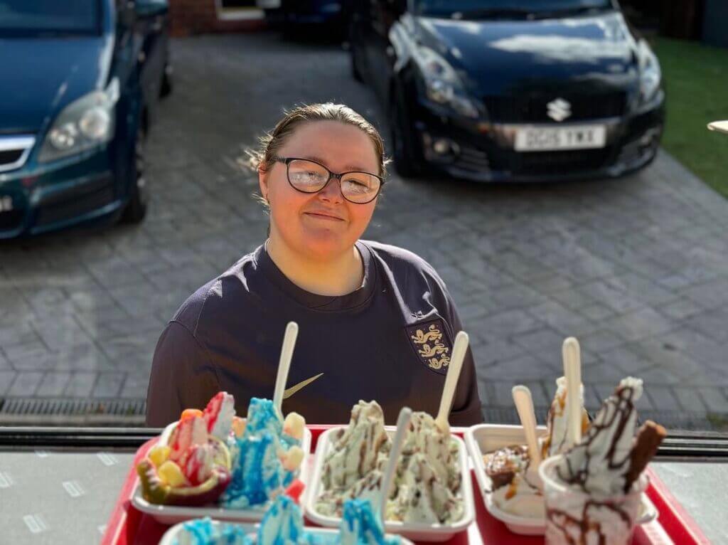 Young girl smiling at her order of shez whippy Crunchie Blast Rocks ice-cream Tray and ice-cream trays and tubs