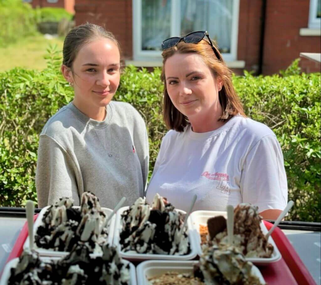 two Ladies with their served order of Tasty Twirl Treat Tray Ice-Creams, Creamy Fudgie Brownie Smile and Lotus Biscoff Toffee Waffle Ice-Cream trays