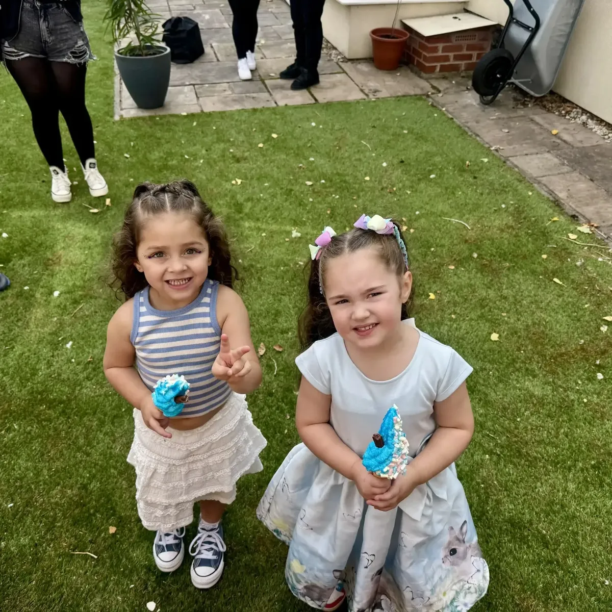Shez Whippy serving ice cream to children on Holly Bank Nursing Home Community event in Radcliffe