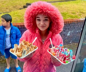 Young girl holding shez whippy Crunchie Blast Rocks ice-cream Tray and Double Fizzy Bomb Blast ice-cream tray