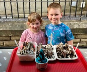 Children smiling with their served order of Tasty Twirl Treat Tray Ice-Cream