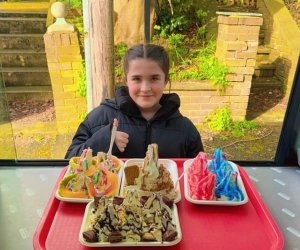 Young girl doing thumbs up with her served ice cream trays by shez whippy on the streets of manchester